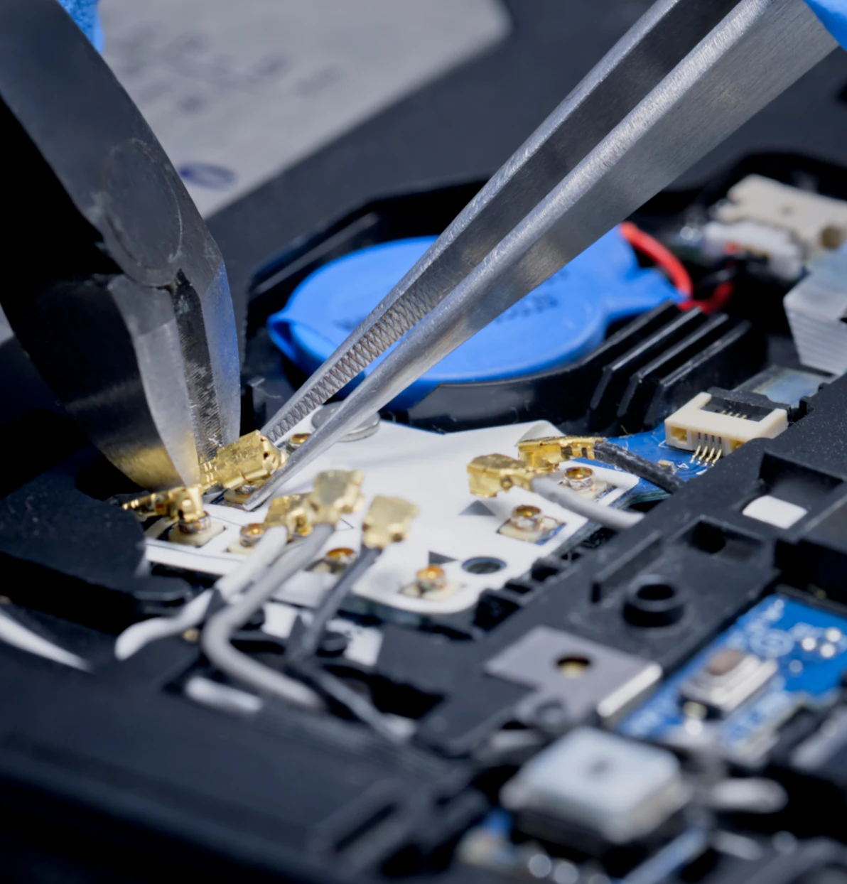 Close-up of electronic components and tools.