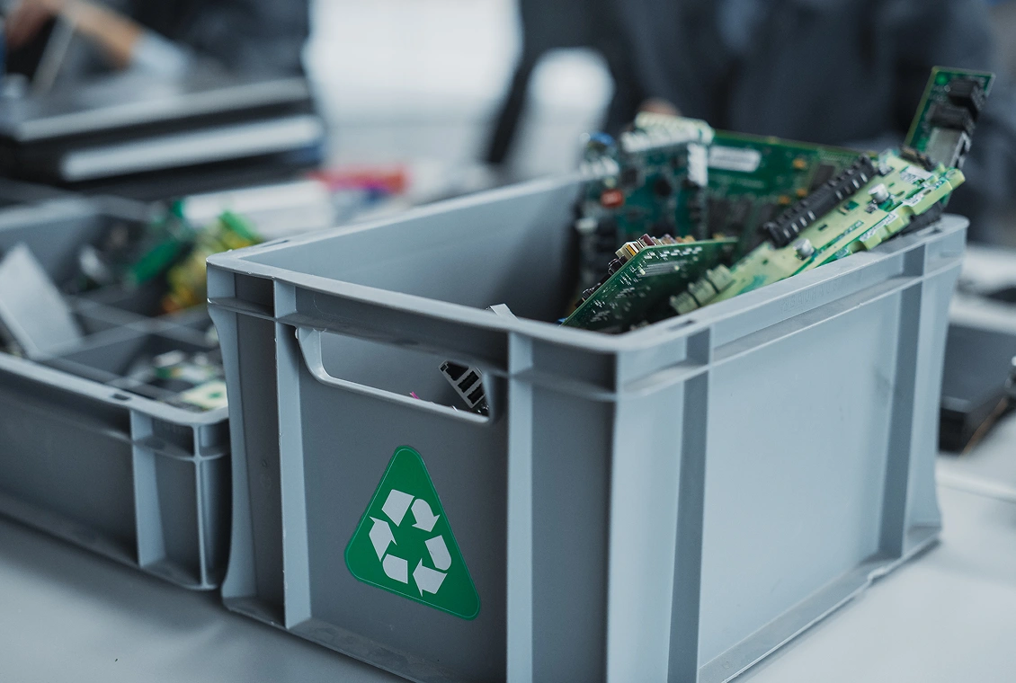 Recycling bin with electronic circuit boards.